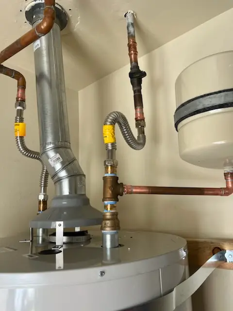 Water heater installation and plumbing repair in Wooded Acres